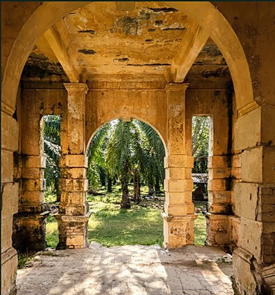 Stone archway opening onto a garden